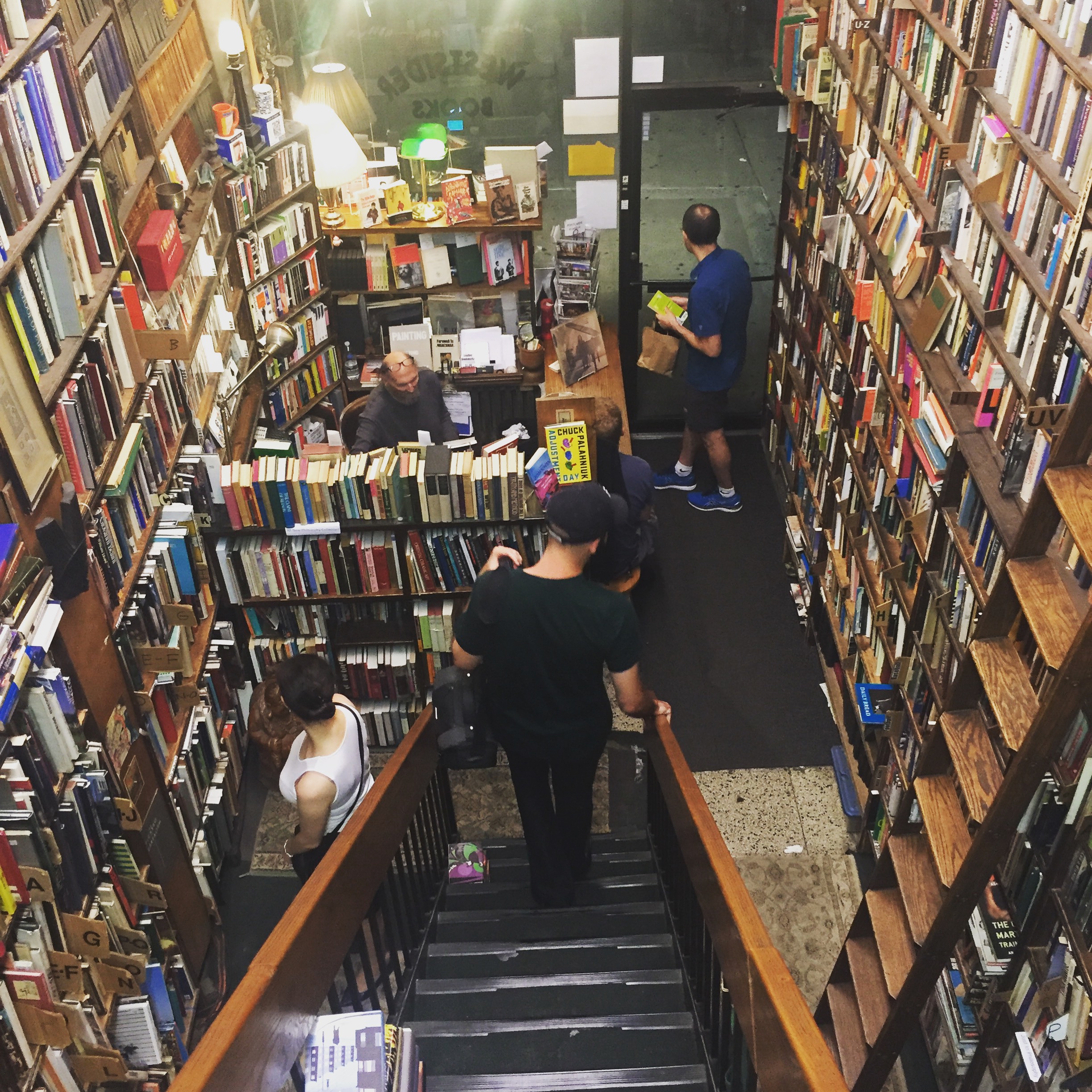 Man descending staircase of Westsider Books in Manhattan